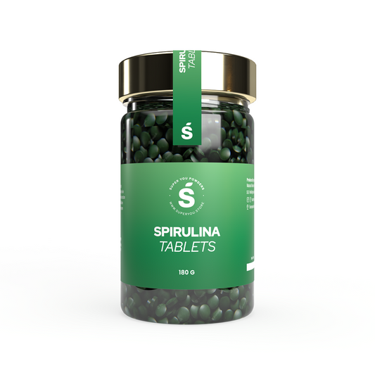 Spirulina tablets superfood in a glass jar